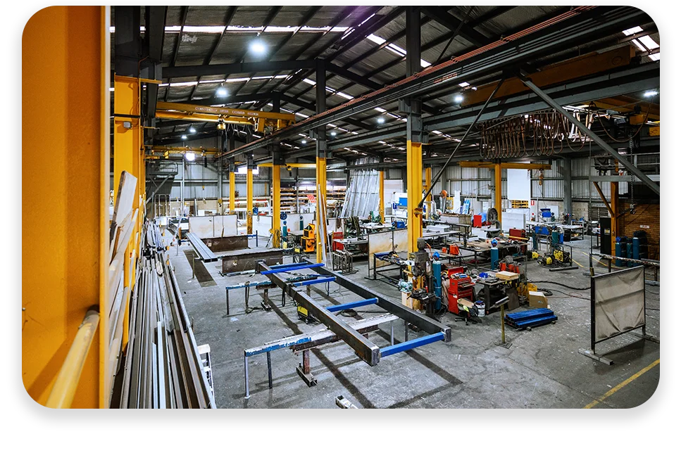 CPQ-Photo-with-two-patterns-three-modules2 An office with cool lighting and business coworkers sitting at a table in a meeting.
