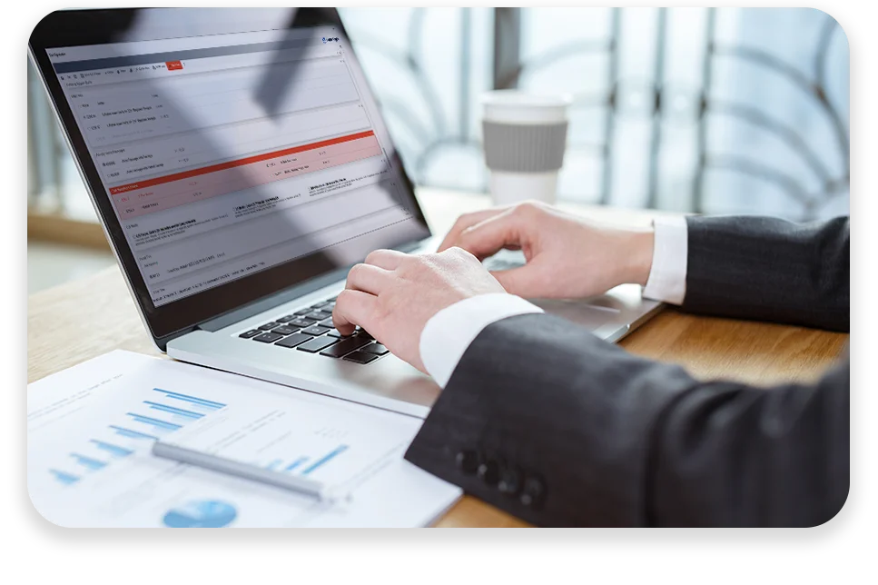 CPQ-Photo-with-two-patterns-three-modules2 An office with cool lighting and business coworkers sitting at a table in a meeting.