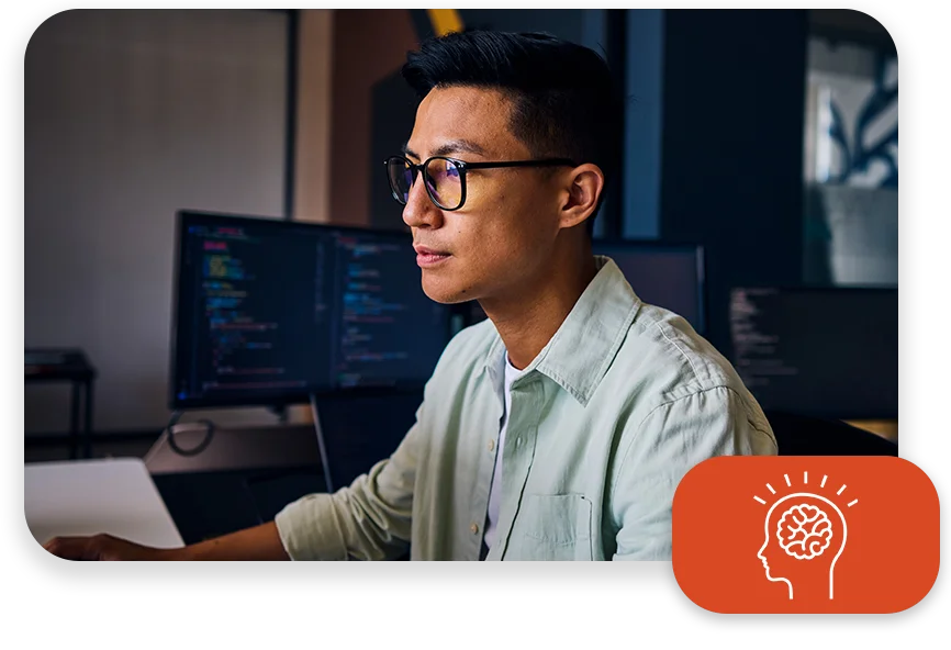 CPQ-Photo-with-two-patterns-three-modules2 An office with cool lighting and business coworkers sitting at a table in a meeting.